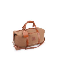 Front angled view of this personalized duffle. It features a brown waxed canvas and British tan Florentine leather trim, accents, handle, detachable strap and luggage tag. There is a leather patch on the front where the initials will be placed.