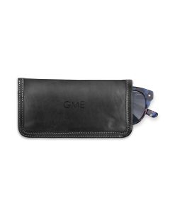 Front view of the personalized leather glasses case. It has black Florentine leather, white stitching and initials are imprinted on the front. Sunglasses are present to show how it work.s