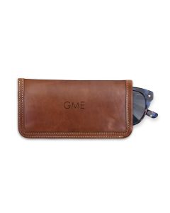 Front view of the Leather Glasses Case with British tan Florentine leather and white stitching. This features imprinted initials on the front and shows the sunglasses partially in the case.