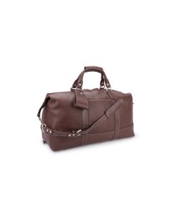 Side angled view of the big leather duffle bag with removable strap, handle wrap and tag. This bag features cioccolato leather throughout.