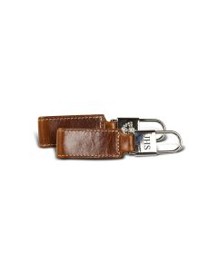 This Chapman key fob features British tan Florentine leather. This image of the personalized leather key fob shows the front with initials and the back with the Barrington crest.