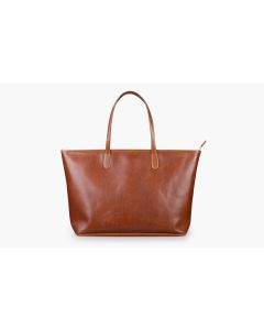 Front view of the St. Anne leather zippered tote. It features British tan Florentine leather and tan stitching. It is shown in the upright position as well as the handles.