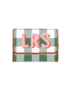 Closed view of the monogrammed hanging toiletry kit with a ditsy floral design in shades of lavender and heather and thistle giant printed initials