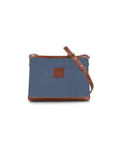 Front view of the personalized crossbody bag with a inkwell chambray design and has a leather patch showing where initials will be placed. There is also an adjustable shoulder strap attached