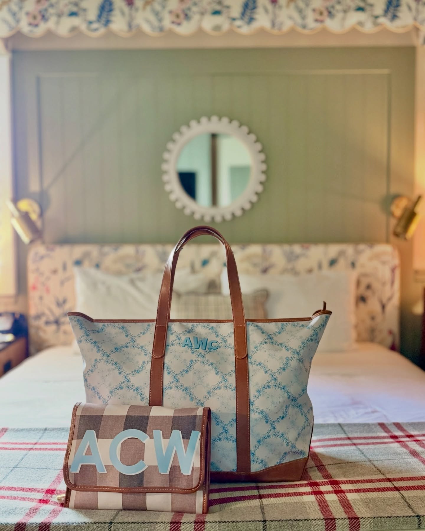 Monogrammed Tote Bags 3 Monogrammed Tote Bags: Our extra large plaid tote with leather handles, perfect for weekend getaways, displayed in a bedroom setting.