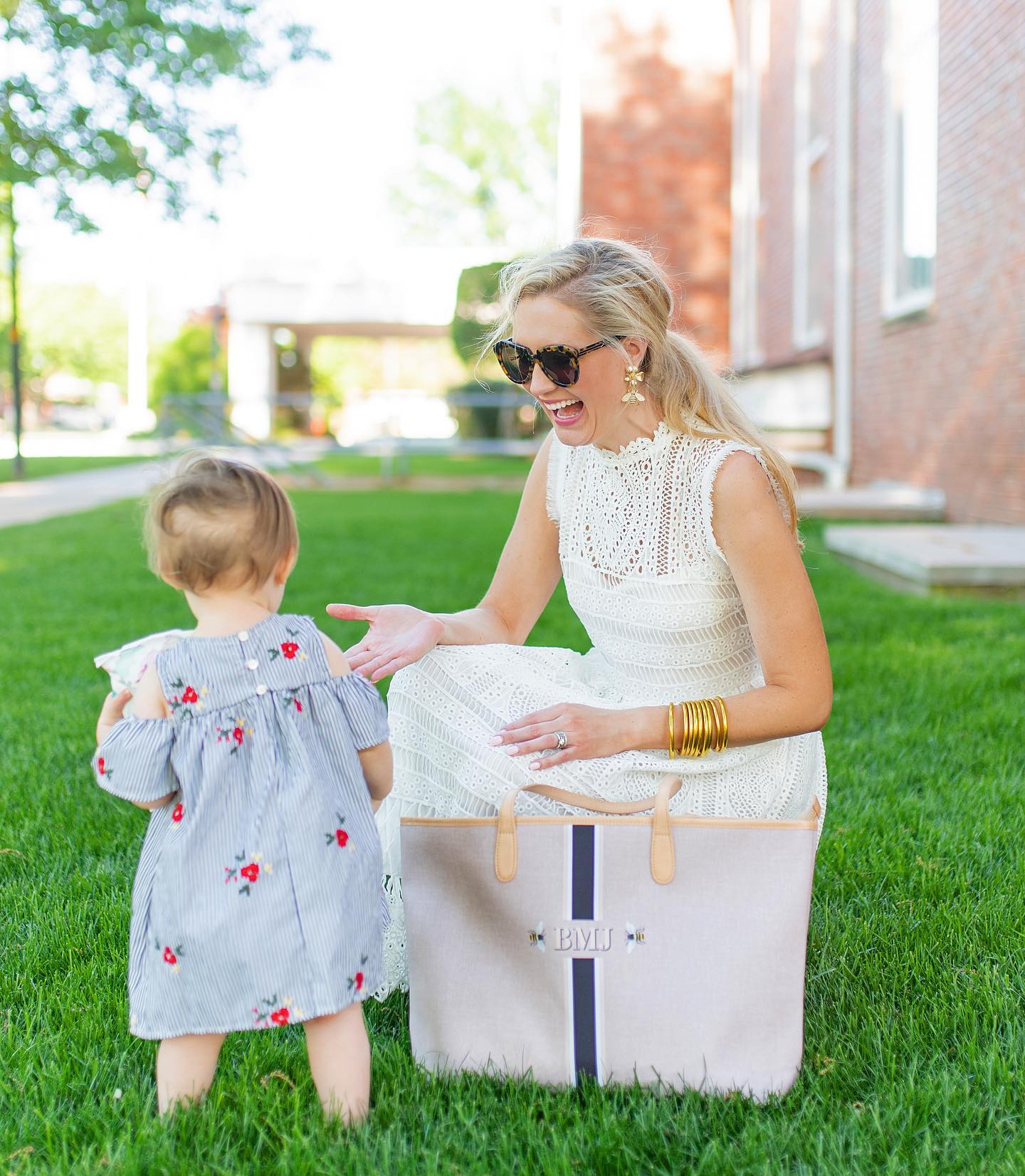 Monogram diaper bag with baby, a must-have for organized and fashionable moms