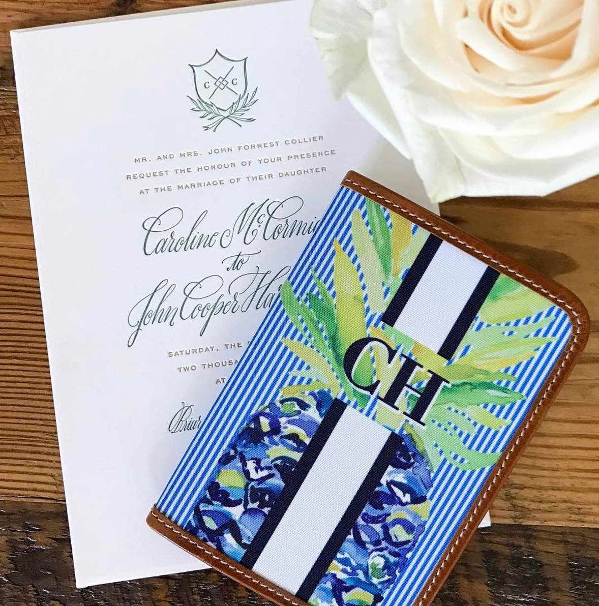 Vibrant green and blue monogram passport holder, adding a pop of color to your travel essentials.
